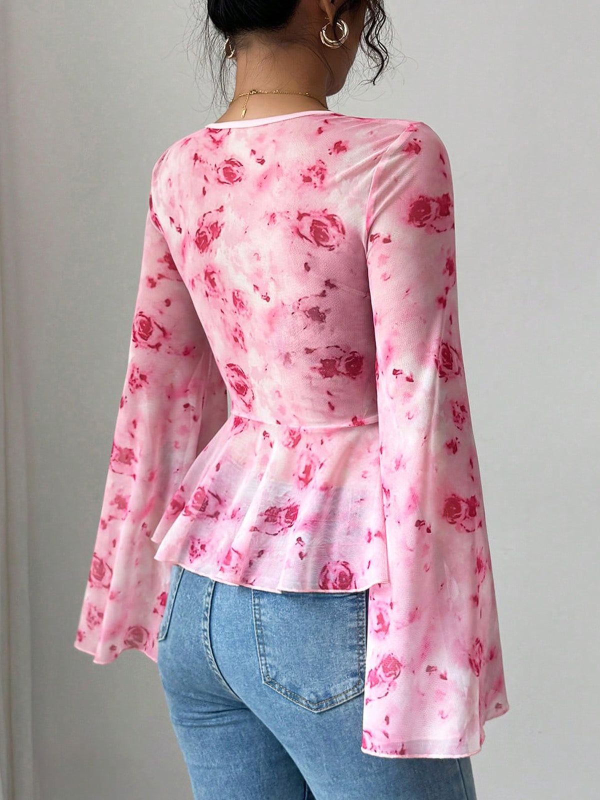 Floral print tie-front chiffon blouse with flare sleeves from Plush Fashion Hub, featuring a stylish and flowy design.