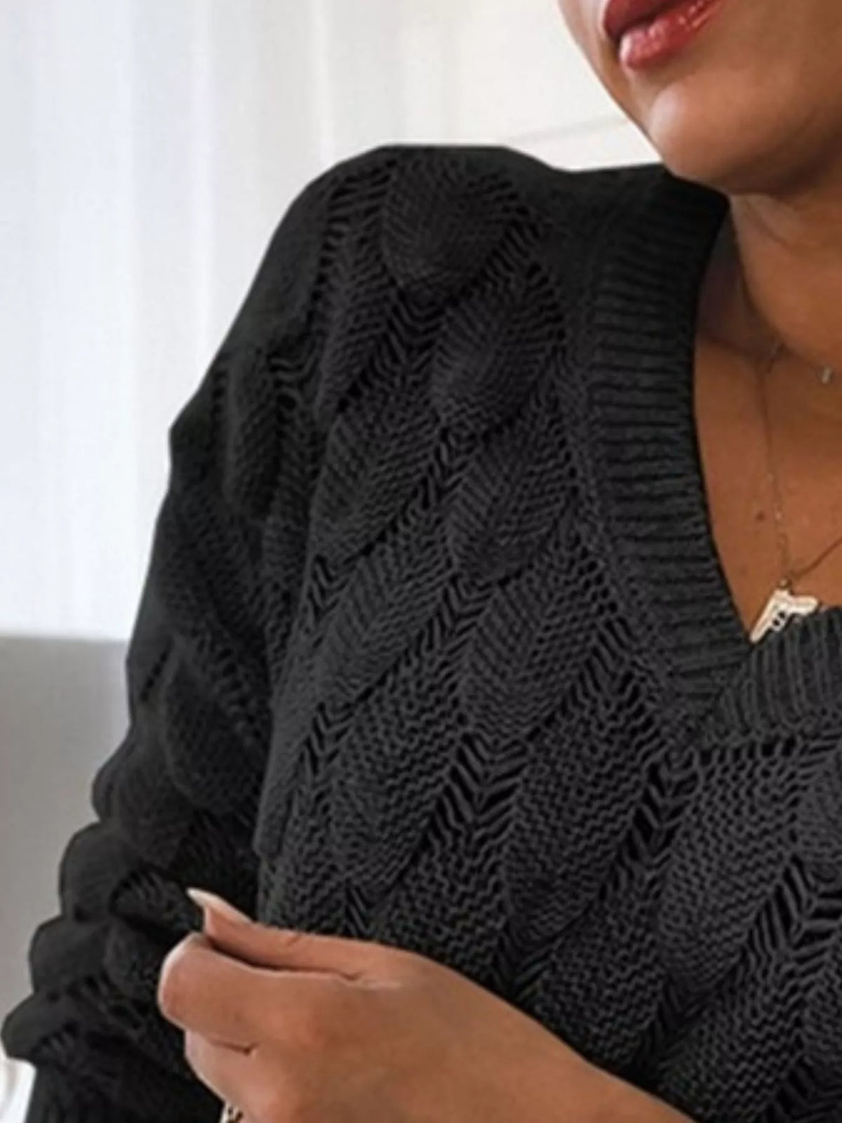 V-neck knitted sweater from Trendsi featuring a cozy, textured design in a neutral color, perfect for casual or layered outfits.