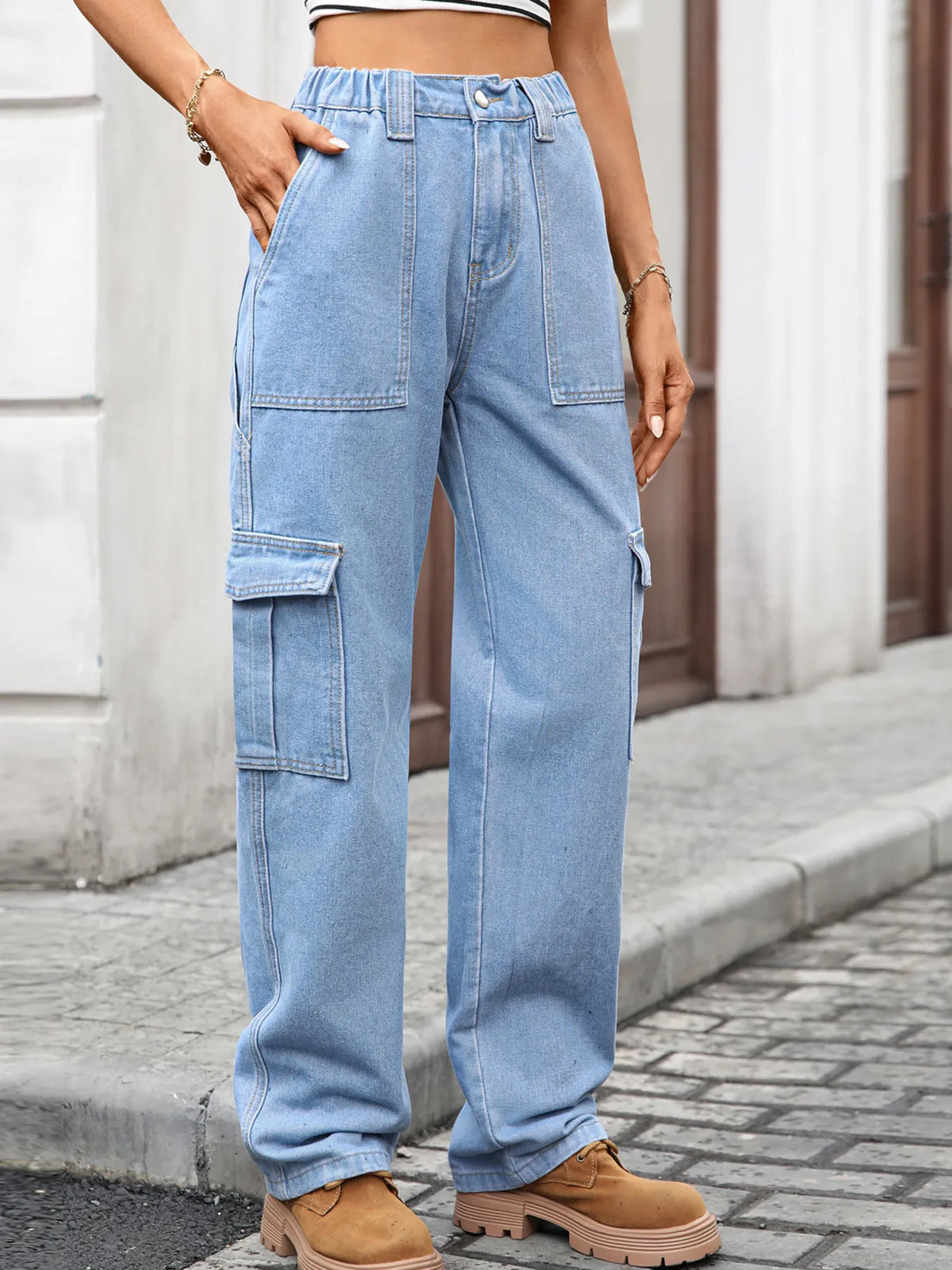 High-waisted cargo denim jeans by Plush Fashion Hub featuring a classic blue denim look and functional side pockets.