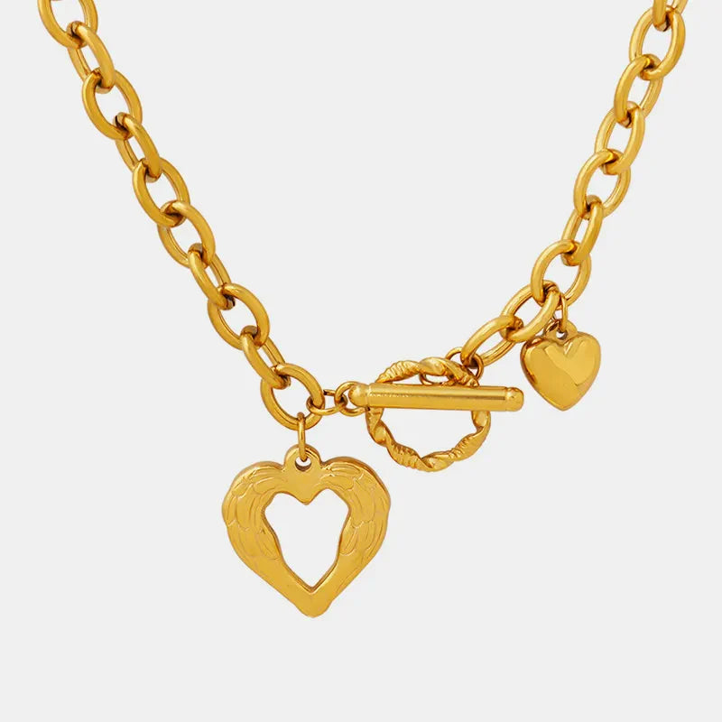 Titanium steel heart pendant necklace with a polished silver finish, featuring a delicate chain and a stylish heart-shaped charm.