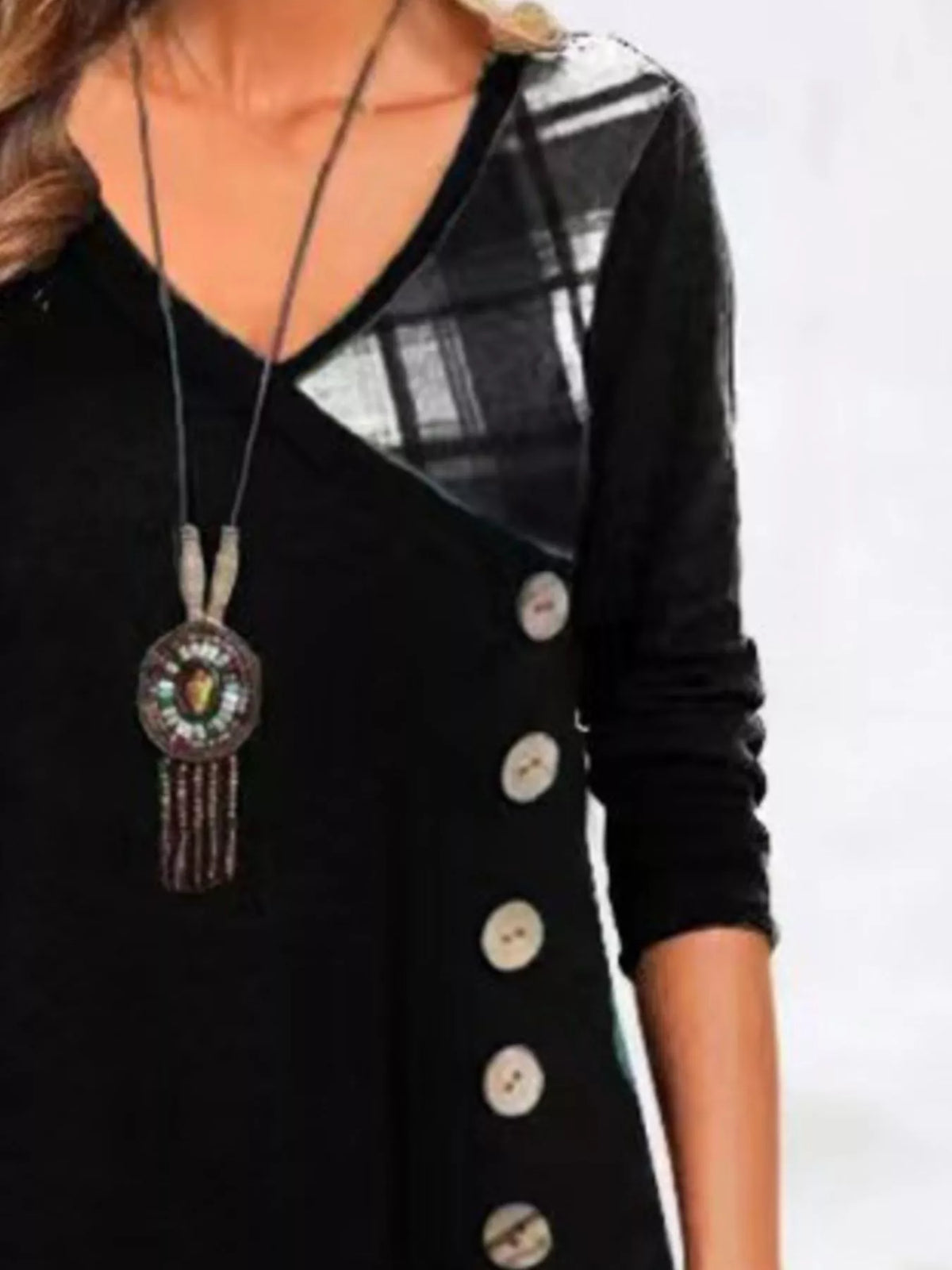 Plus size asymmetrical plaid patchwork long sleeve dress by Trendsi, featuring a stylish design with mixed plaid patterns and a flattering fit.