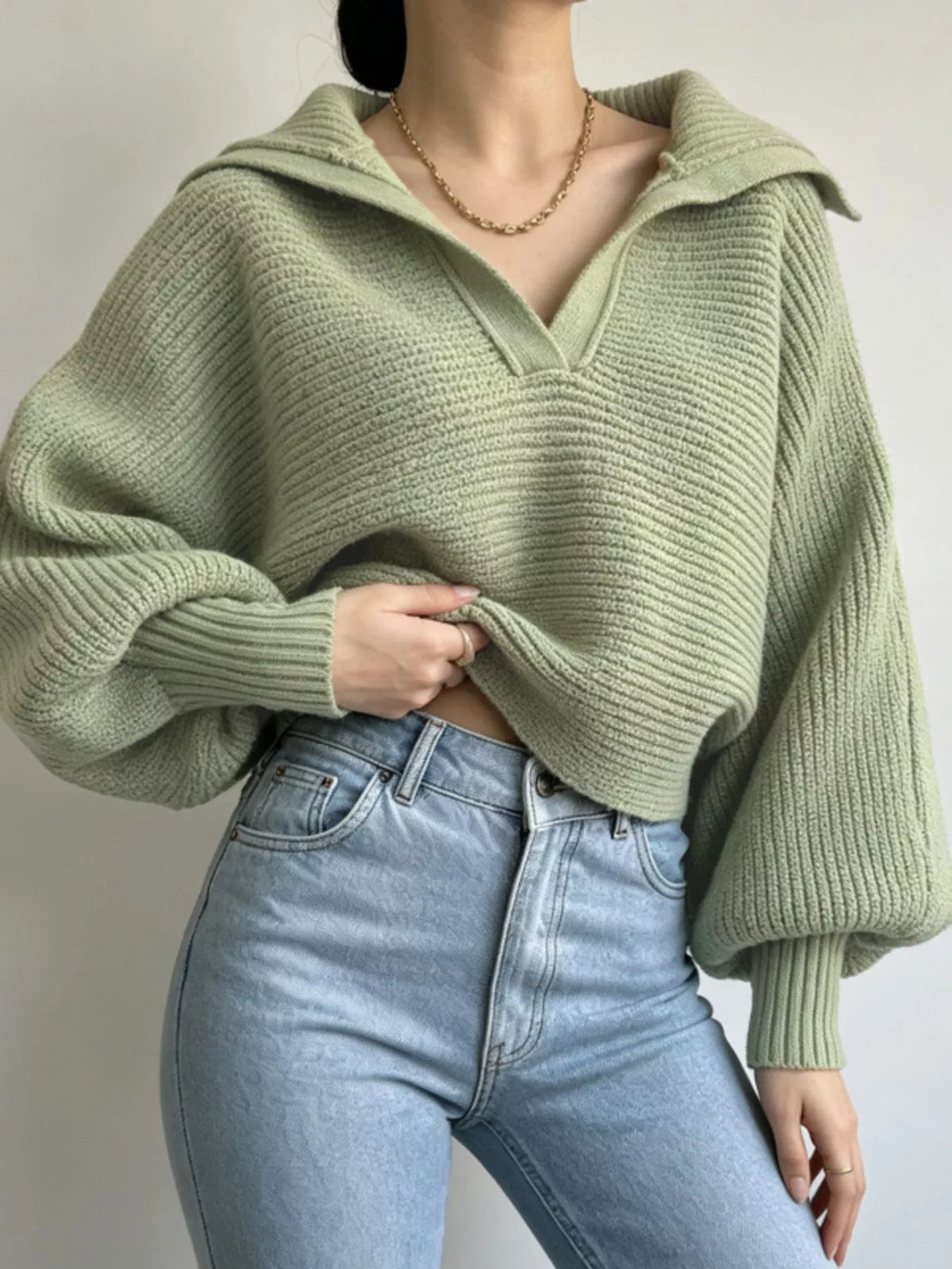 Trendsi women's ribbed cropped sweater with oversized collar, featuring a fitted knit design and stylish collar detail.