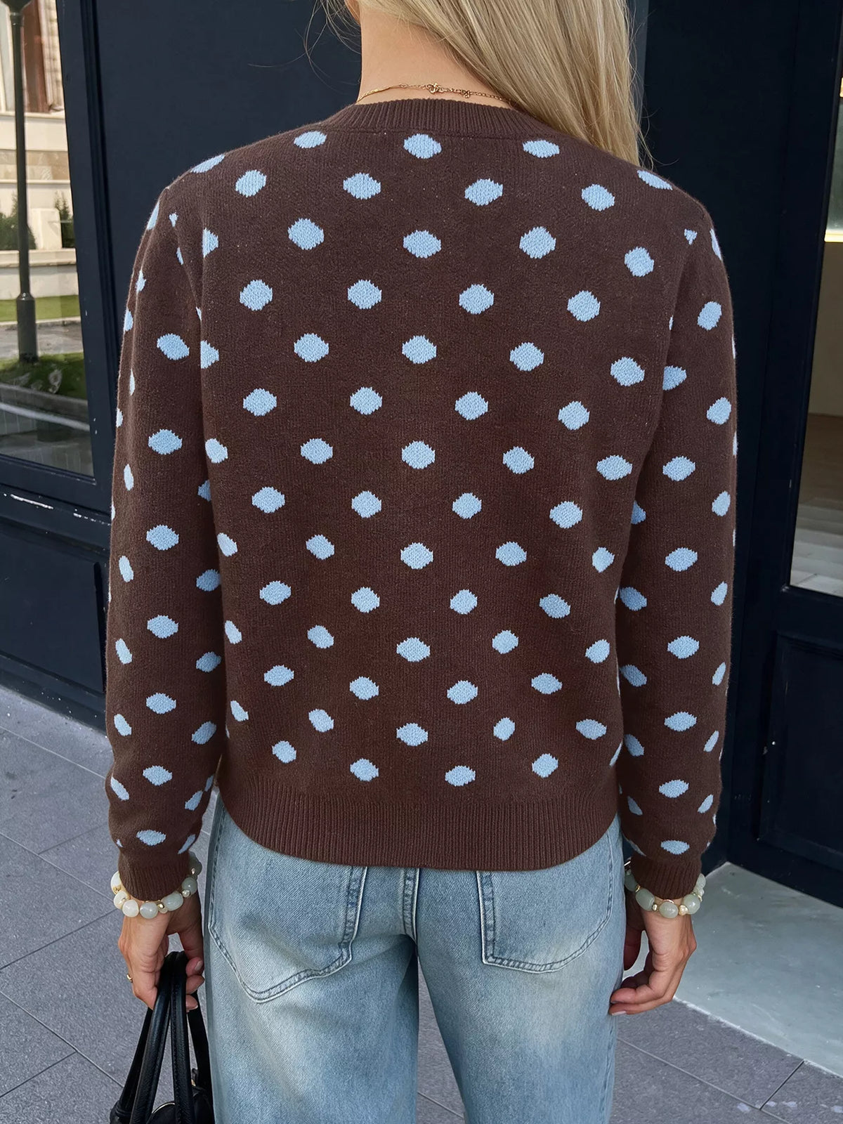 Women’s polka dot button-up cardigan from Trendsi, featuring a classic knit design with a front button closure and long sleeves.