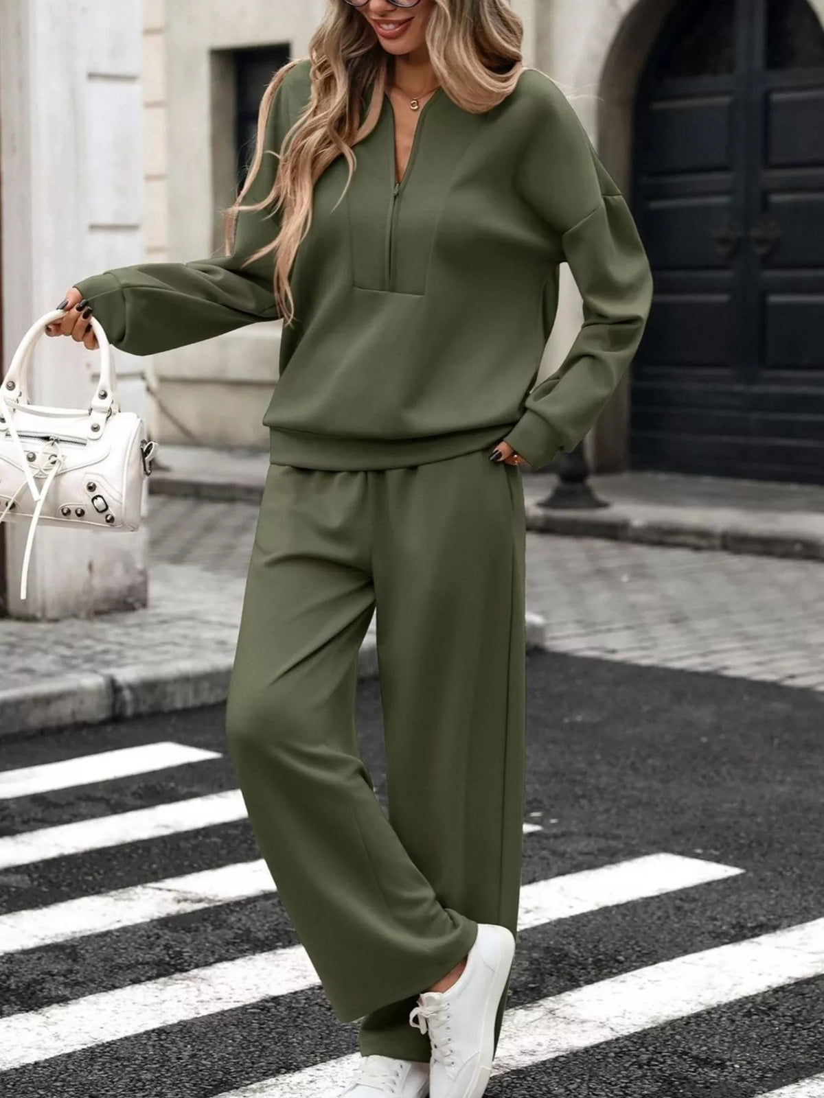 Women’s gray half zip sweatshirt and wide-leg pants set by Trendsi, casual loungewear outfit featuring comfortable fabric and relaxed fit.