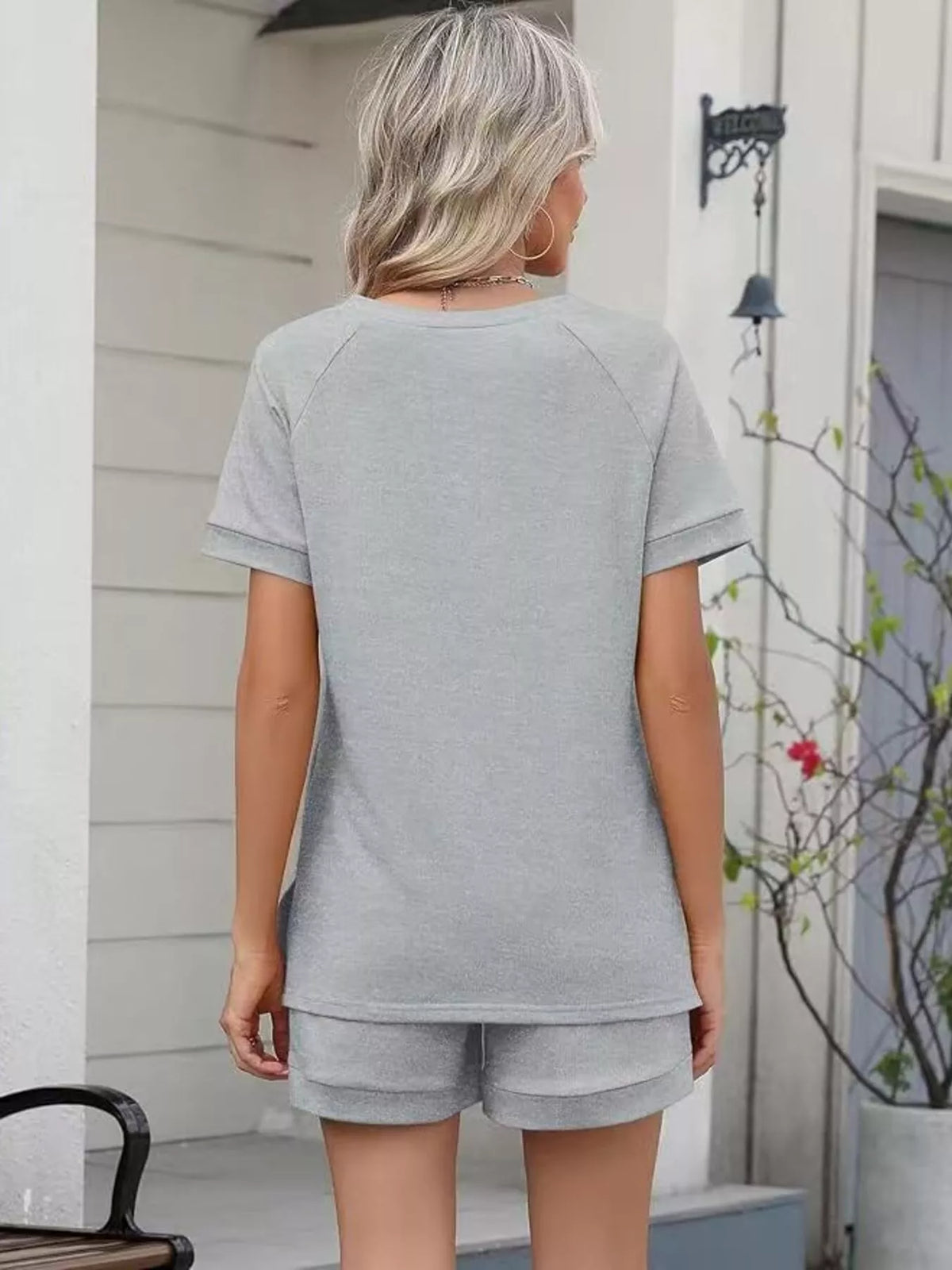 Solid color short sleeve top and shorts two-piece set by Plush Fashion Hub, casual summer apparel for women.