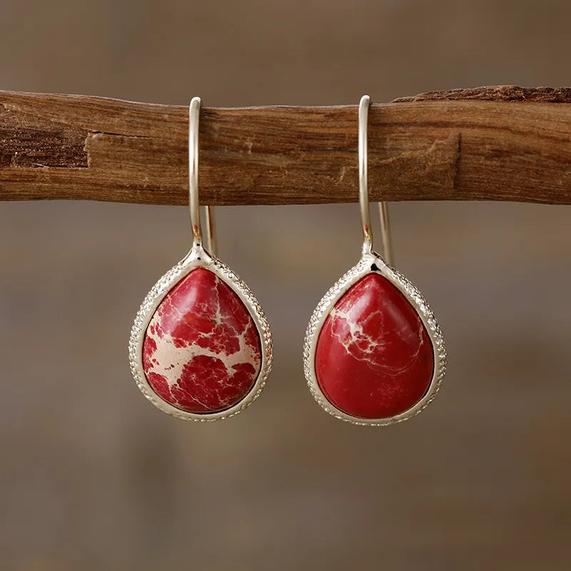 Copper natural stone teardrop earrings featuring a polished finish and elegant design, perfect for stylish accessories.