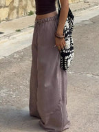Striped wide-leg pants from Trendsi, stylish and comfortable bottoms with a relaxed fit and bold pattern.