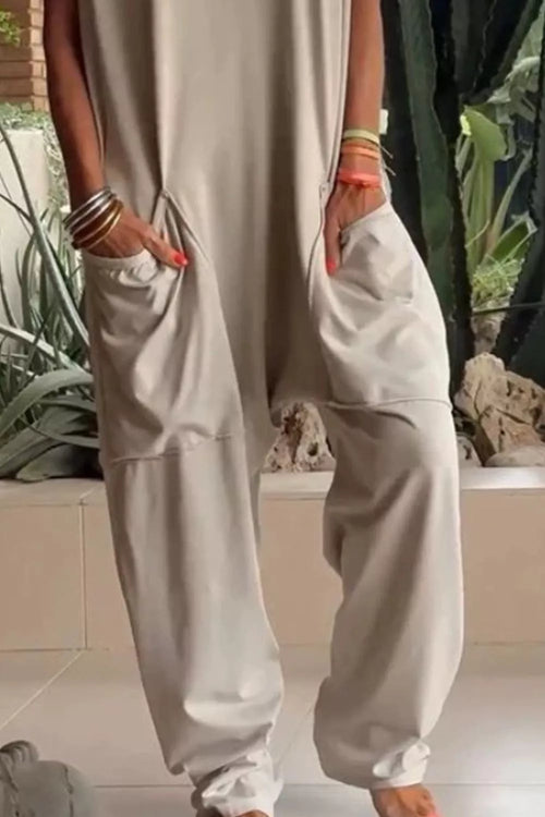 Plus size casual V-neck short sleeve jumpsuit with pockets by Trendsi, shown in a full-length front view.