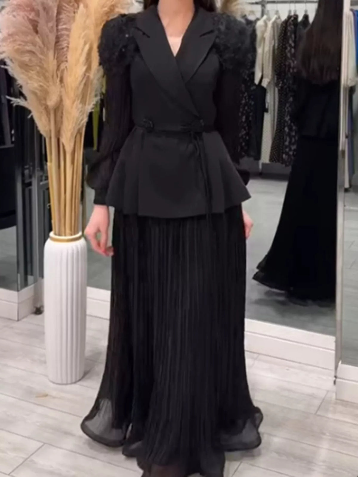 Plush Fashion Hub two-piece set with frill lapel collar top and pleated skirt, stylish and coordinated outfit for women.