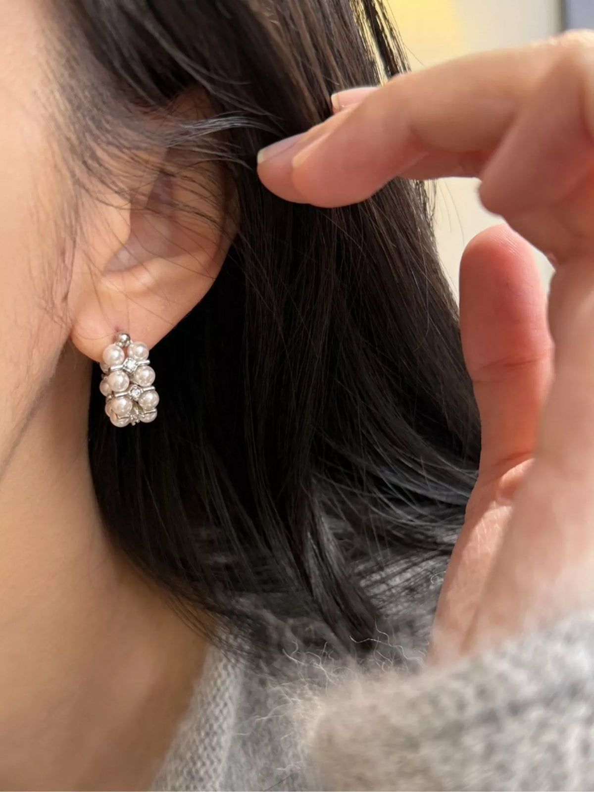 Elegant pearl hoop earrings from Plush Fashion Hub, showcasing classic white pearls on sleek gold hoops.