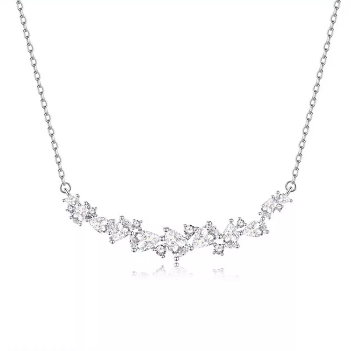 Sterling silver zircon necklace with delicate chain and sparkling stones, perfect for elegant jewelry styling.