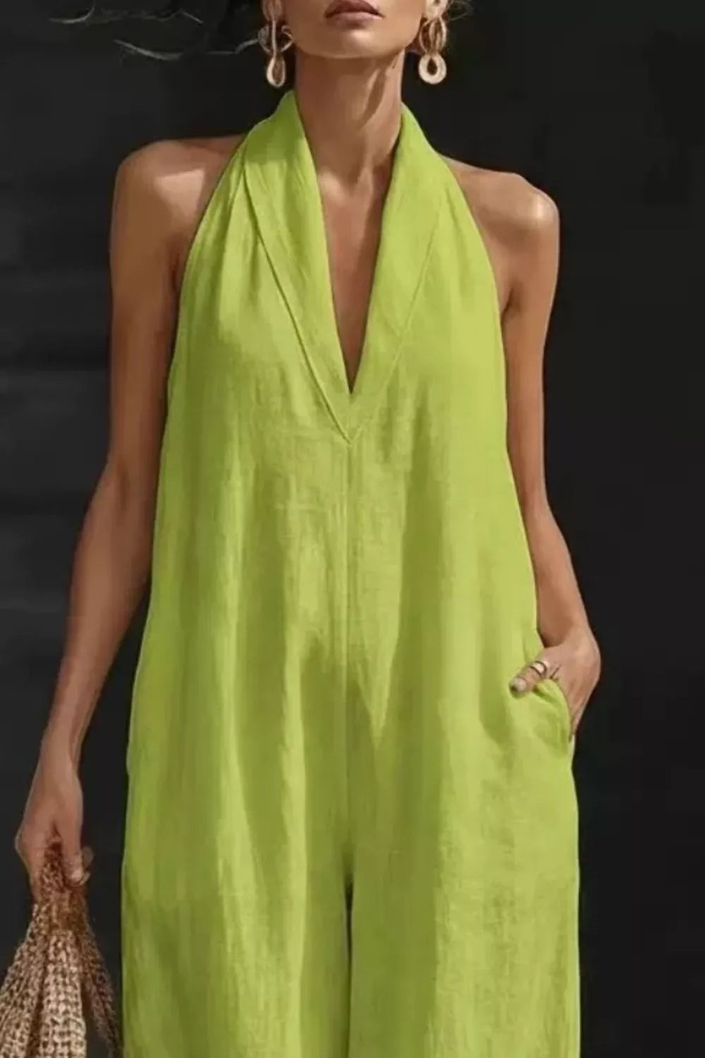 Women's sleeveless wide-leg jumpsuit with pockets from Plush Fashion Hub, featuring a casual romper style and relaxed fit.