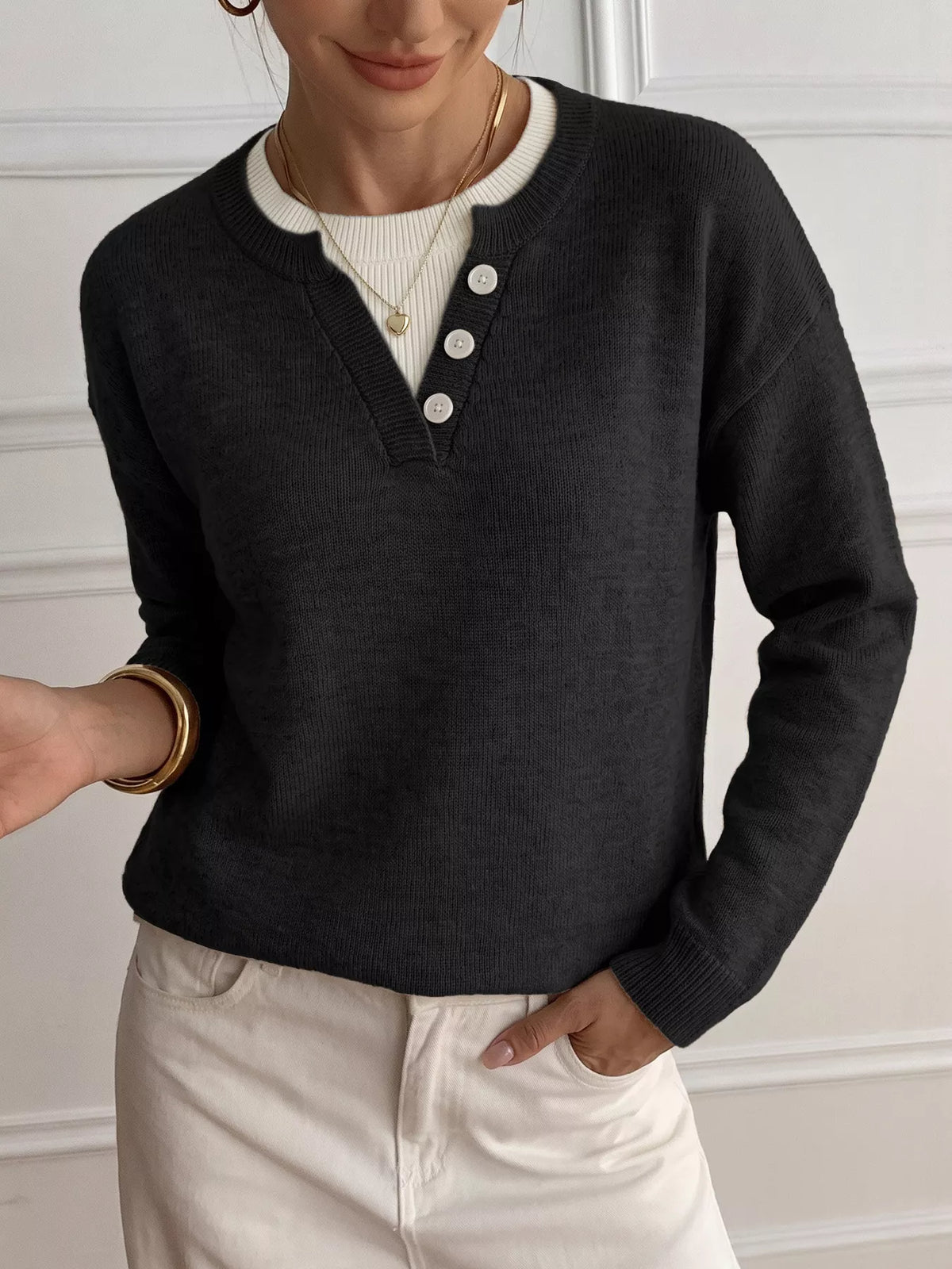 Ribbed knit sweater with button-placket details, featuring a cozy, fitted design in neutral tones, from Trendsi.