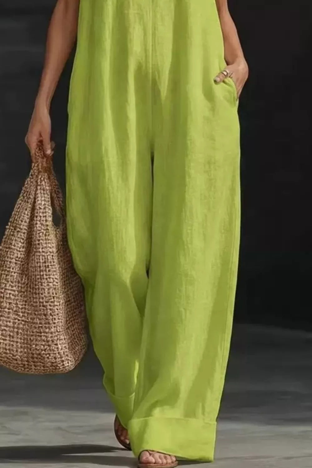 Women's sleeveless wide-leg jumpsuit with pockets by Plush Fashion Hub, casual romper in a comfortable, stylish design.