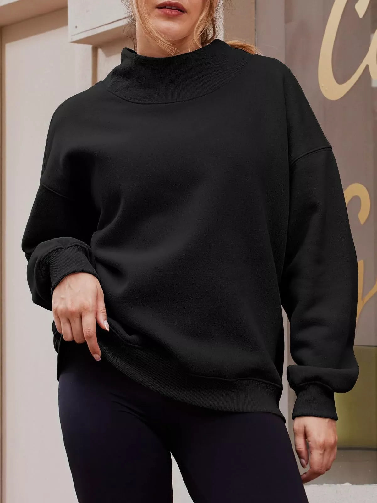 Women’s oversized casual pullover sweatshirt with mock neck and dropped shoulders by Plush Fashion Hub, in a relaxed fit.