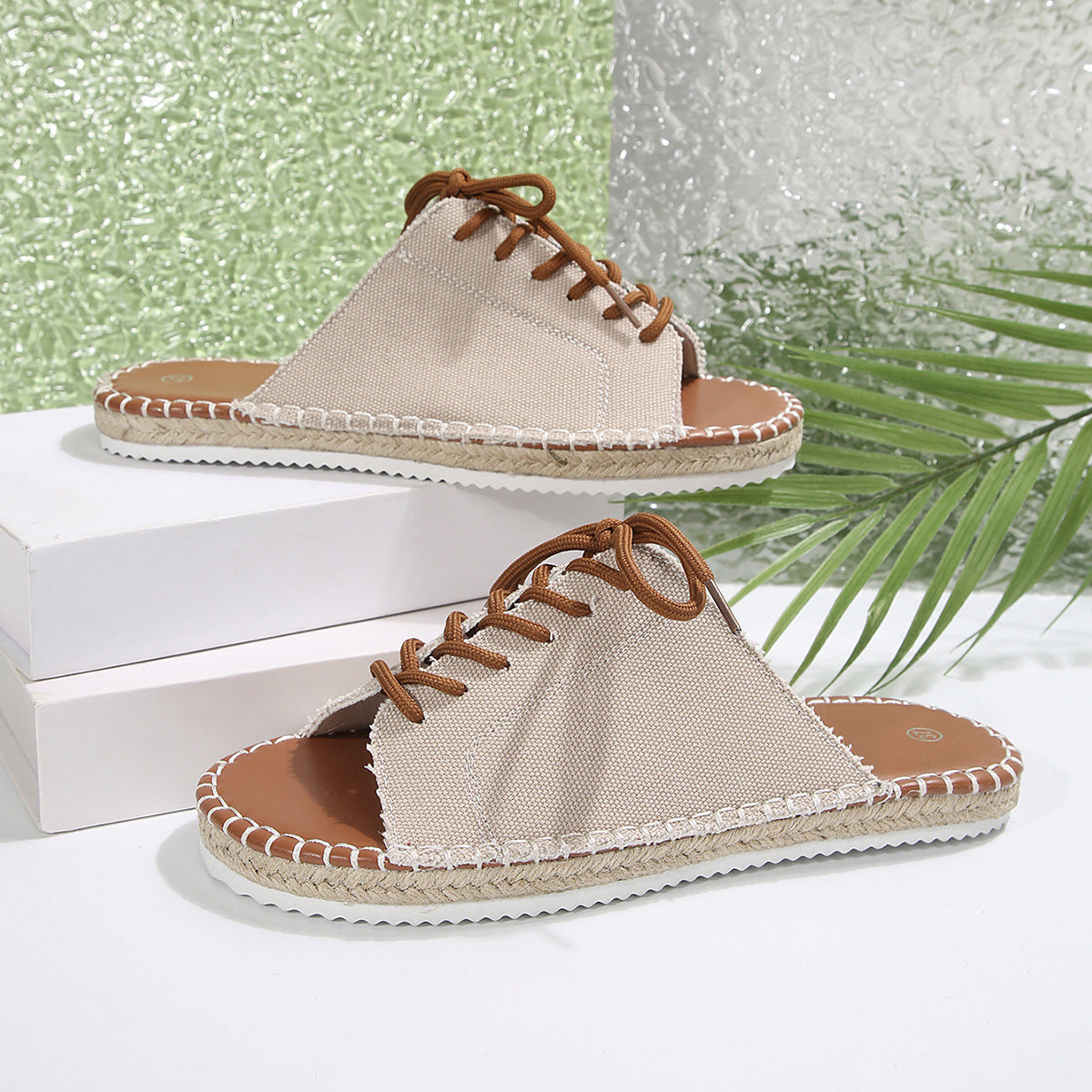 Women’s faux leather lace-up open toe flat sandals by Plush Fashion Hub, showing stylish design and open toe detail.