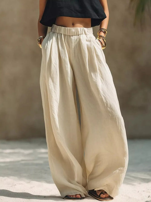 Plus size wide leg pants with full elastic waistband by Trendsi, featuring a relaxed fit and flowing fabric.