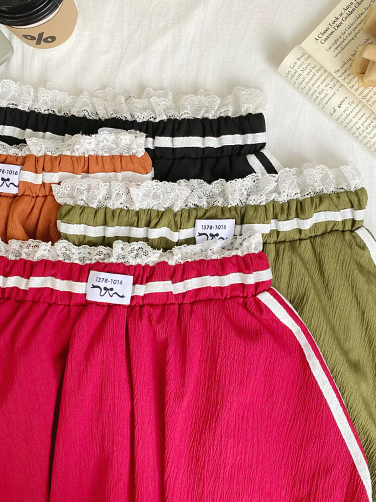 Plush Fashion Hub lace trim elastic waist mini skirt with a fitted design and decorative lace details.