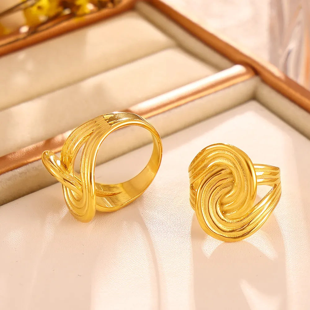 Gold-plated twisted ring from Plush Fashion Hub, showcasing a sleek, stylish design perfect for elegant jewelry collection.