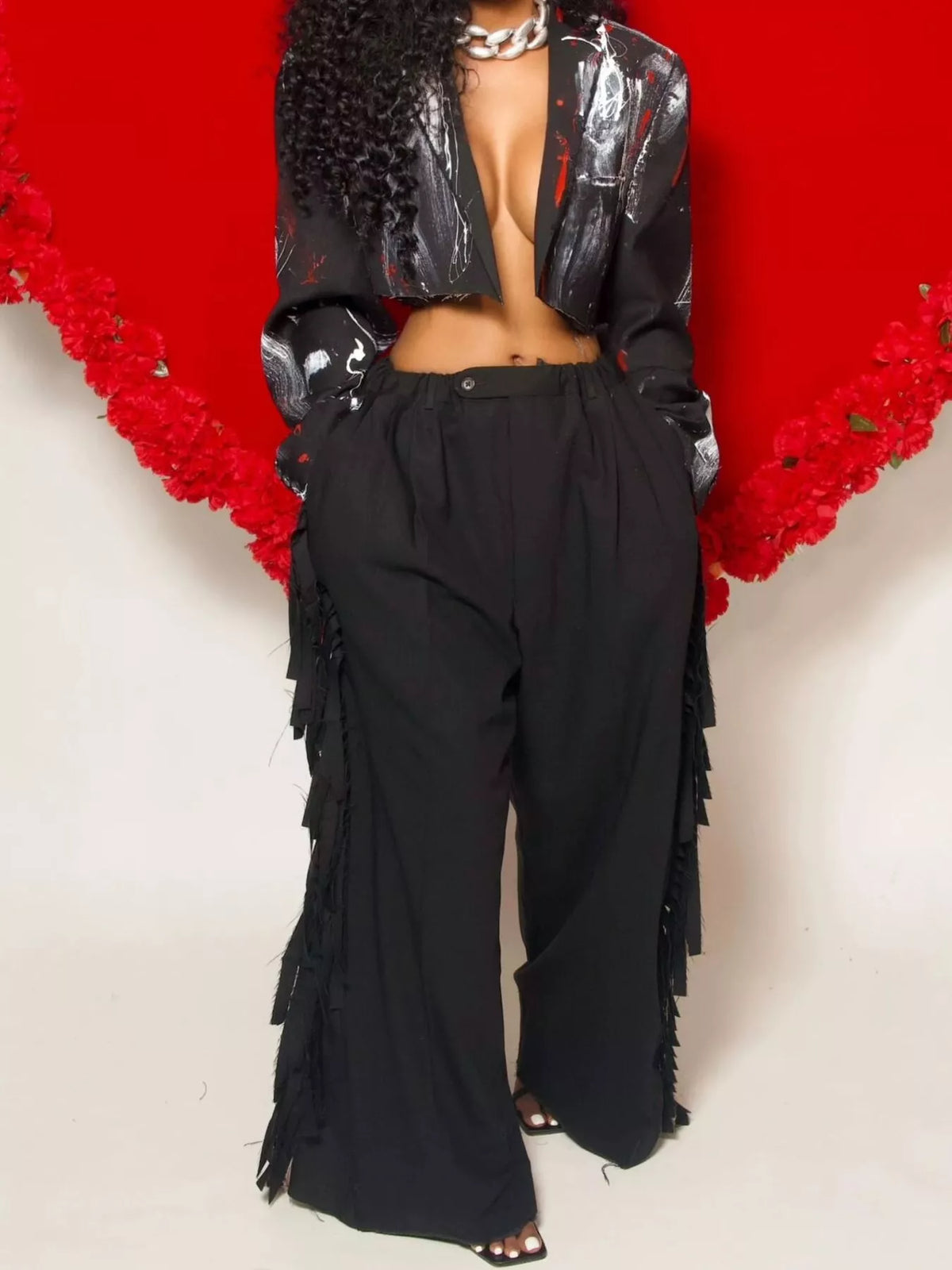 Wide-leg women's pants with fringed details by Trendsi, featuring a relaxed fit and stylish boho-inspired design.