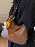 Vintage-inspired PU leather hobo shoulder bag with slouchy design, featuring a trendy and spacious style for casual carry.