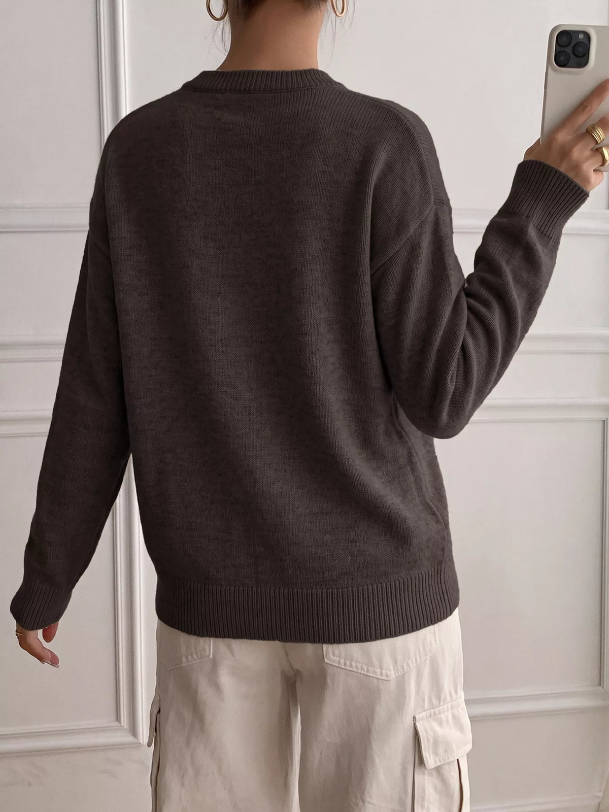 Ribbed knit sweater with button-placket detail, featuring a cozy, fitted design in neutral tones from Trendsi.