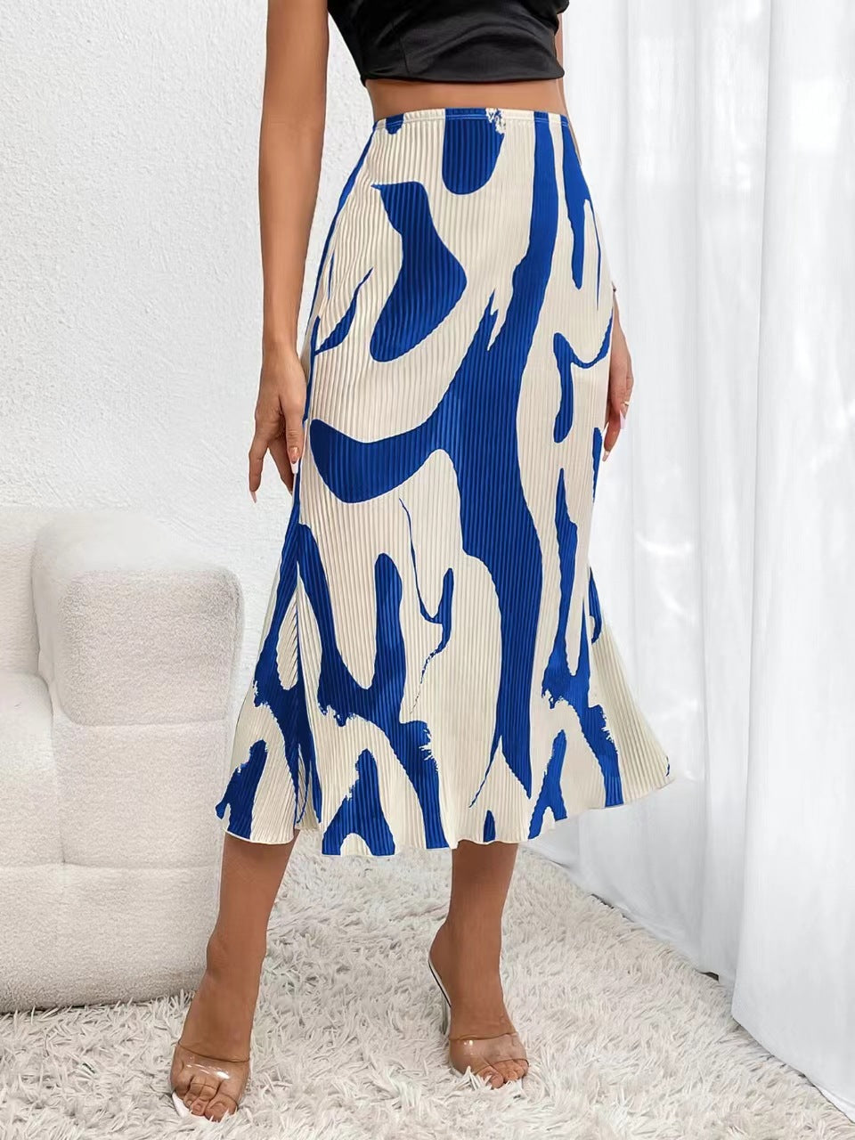Women's zebra print pleated casual skirt with irregular hem and side slit, by FitiqueFit, shown in a stylish, flowing design.