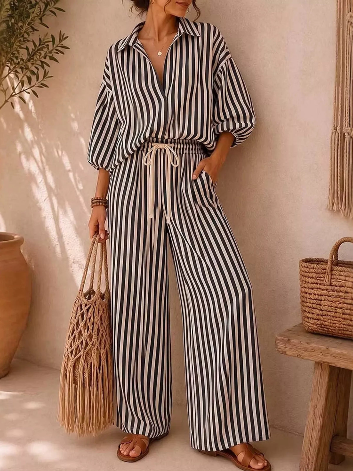 Plus size striped puff sleeve shirt and wide-leg drawstring pants matching set by Trendsi, featuring a trendy, comfortable design.