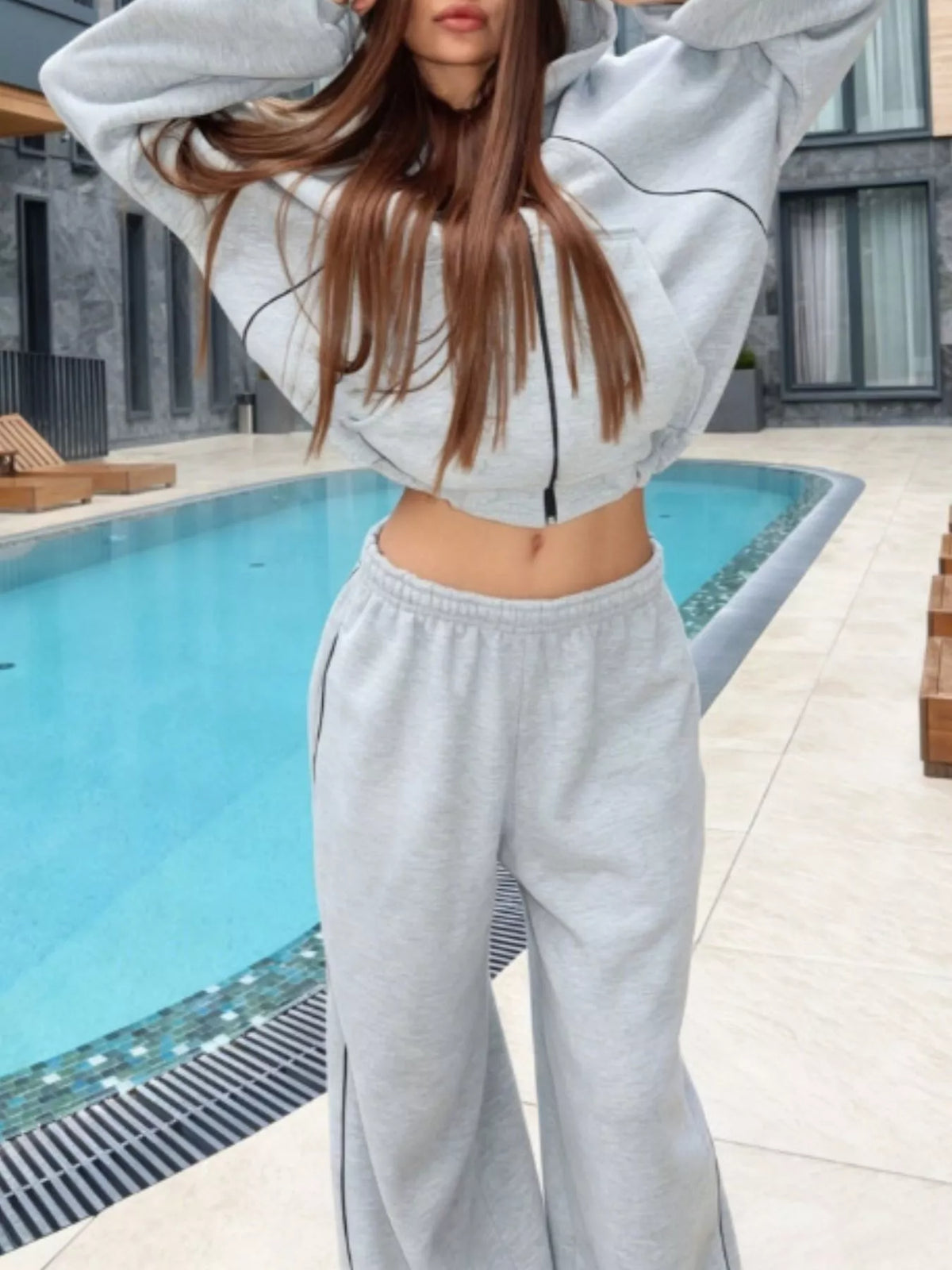 Trendsi cropped zip-up hoodie and wide-leg sweatpants lounge set, with the hoodie featuring a front zipper and relaxed fit.