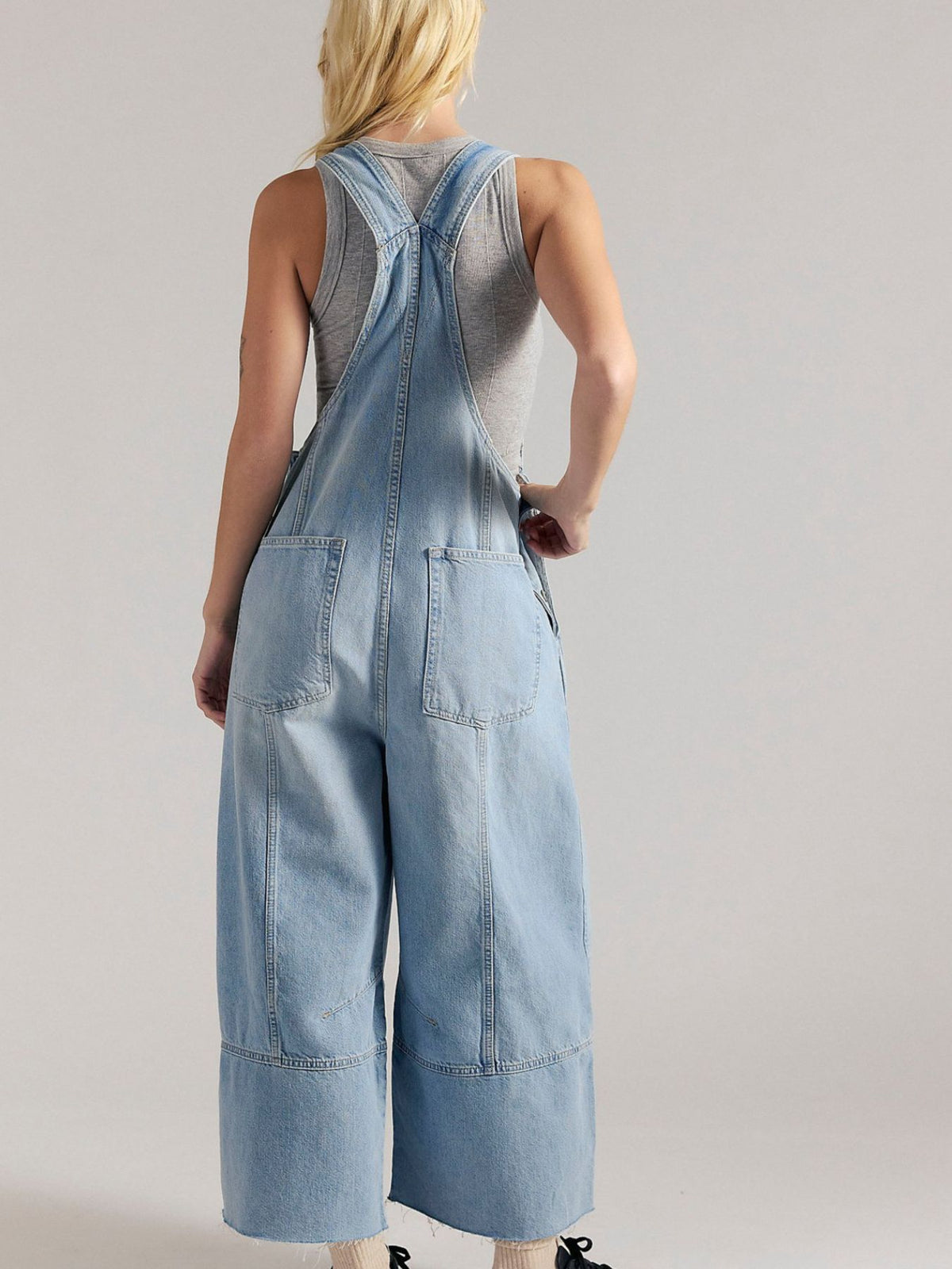 Lightweight casual denim jumpsuit with raw hem, wide-leg style from Plush Fashion Hub, featuring a relaxed fit and trendy design.
