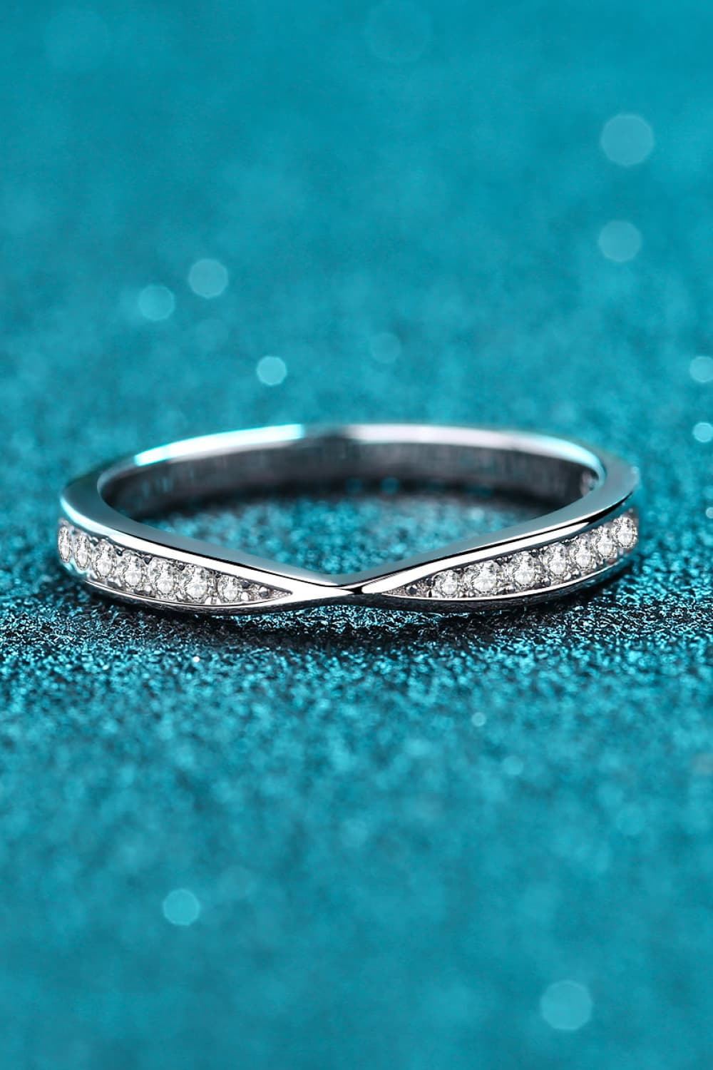 Rhodium-plated moissanite ring with sparkling gemstones, elegant jewelry piece from Plush Fashion Hub, displayed on a white background.