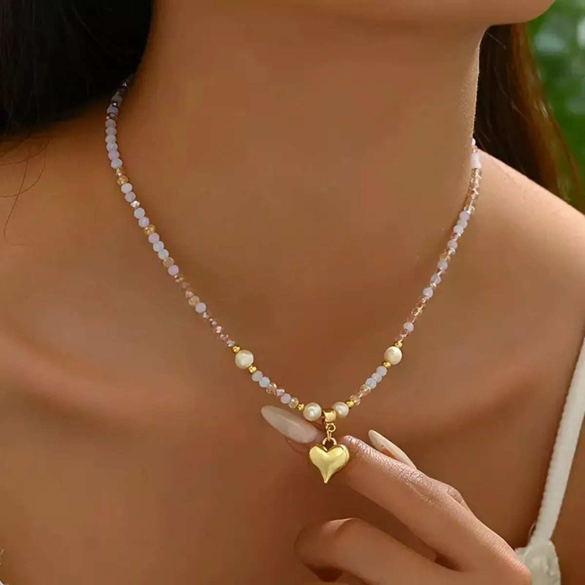 Bead heart pendant necklace by Plush Fashion Hub featuring a delicate heart-shaped bead design on a silver chain.