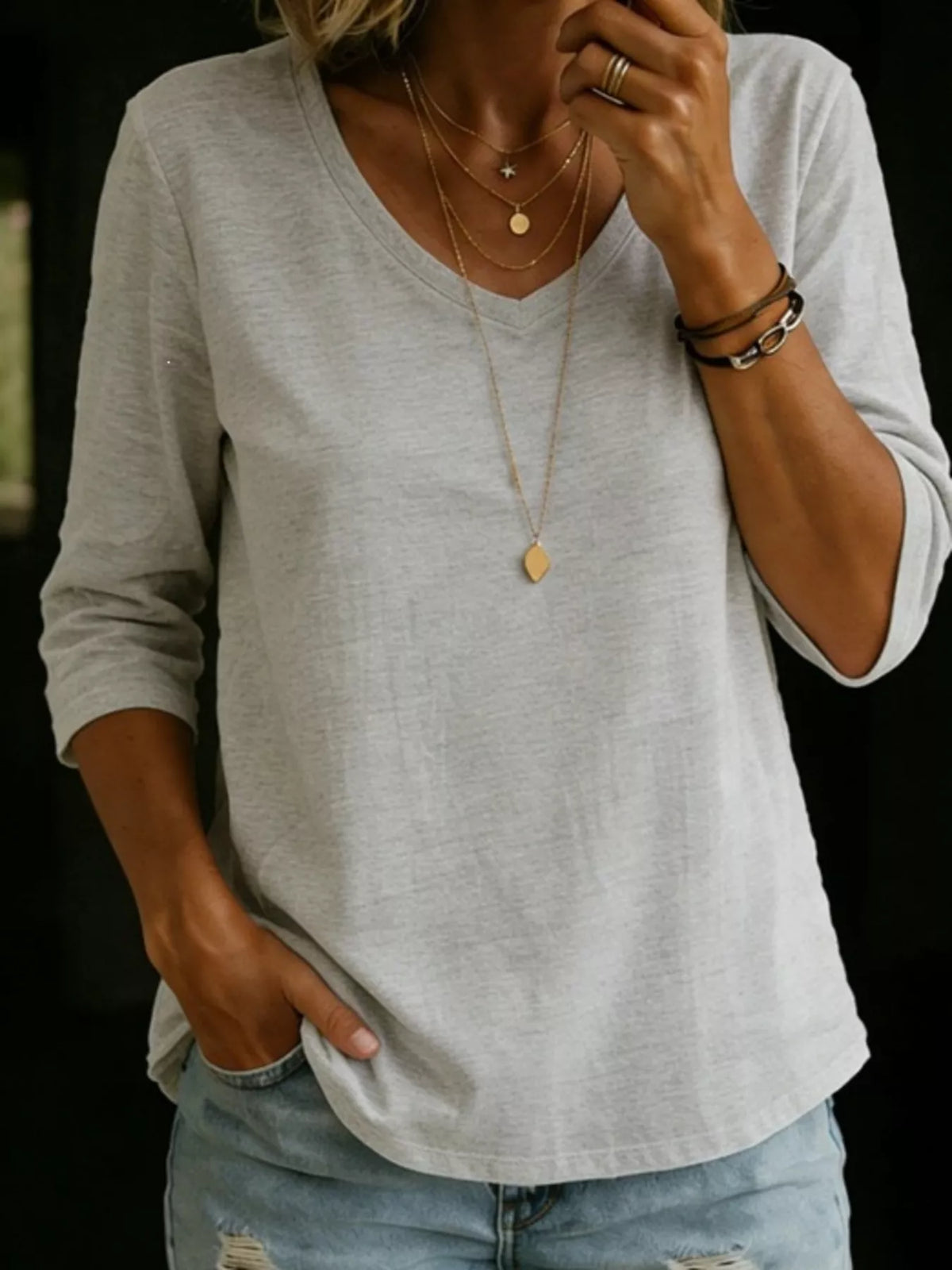 Plus size V-neck T-shirt with 3/4 sleeves from Trendsi, showcasing a comfortable, full-size women's top in a casual style.