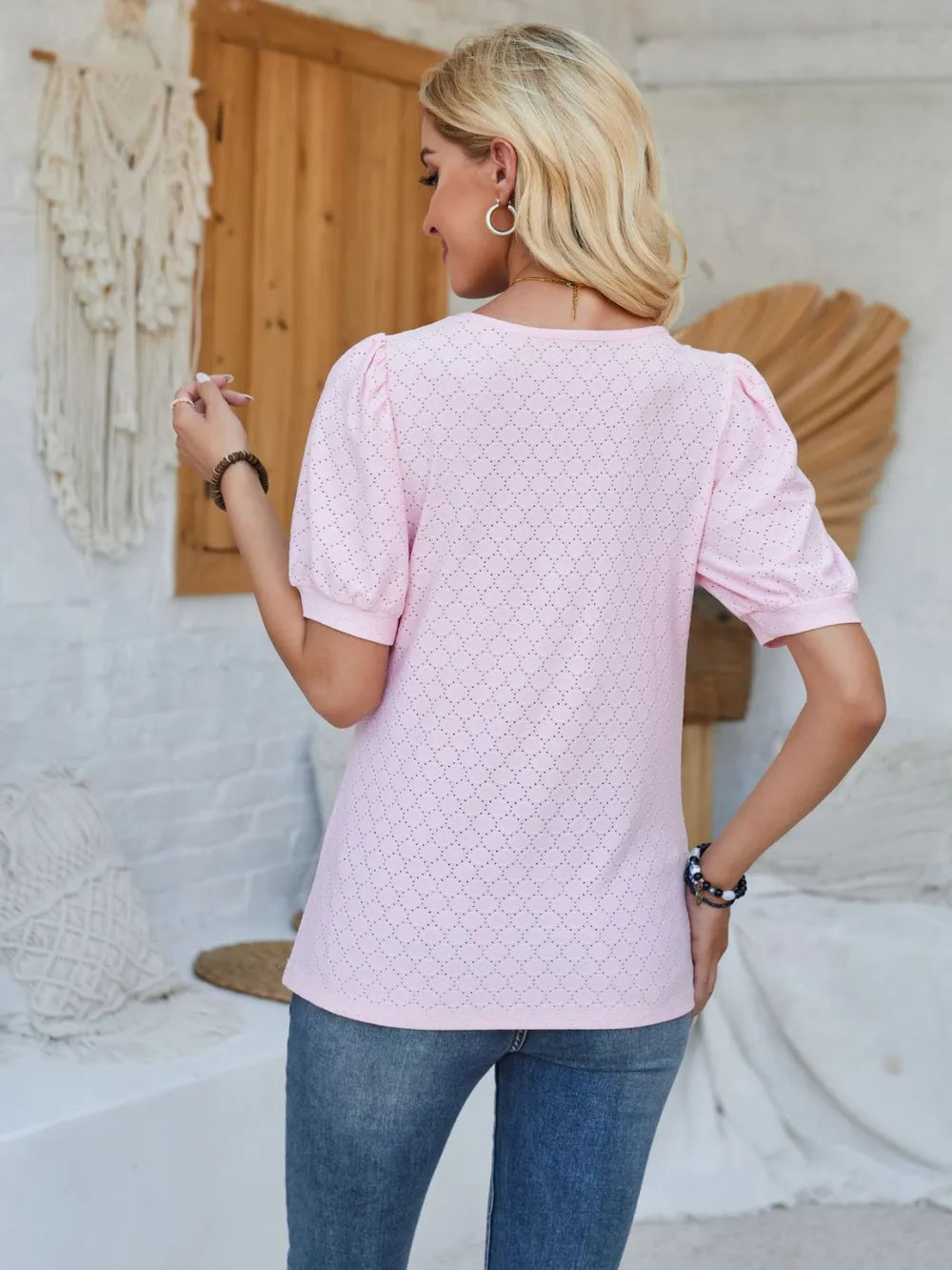 White eyelet asymmetrical neck short sleeve T-shirt from Trendsi featuring a stylish neckline and casual top design.