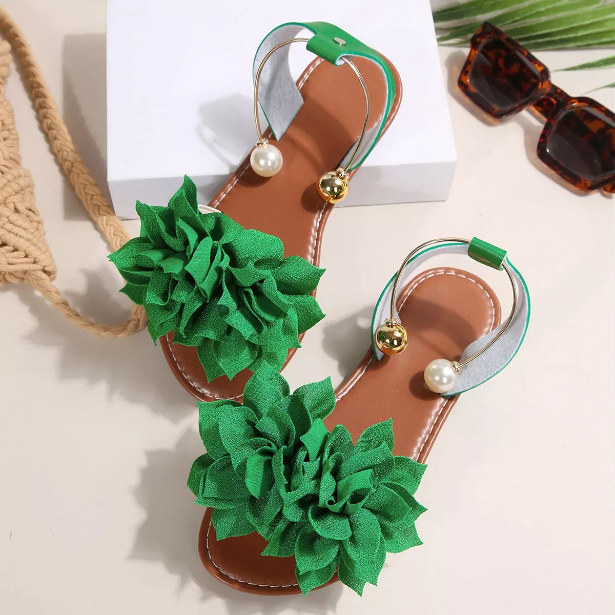 Plush Fashion Hub floral decor flat sandals with colorful flower embellishments and open-toe design on a neutral background.