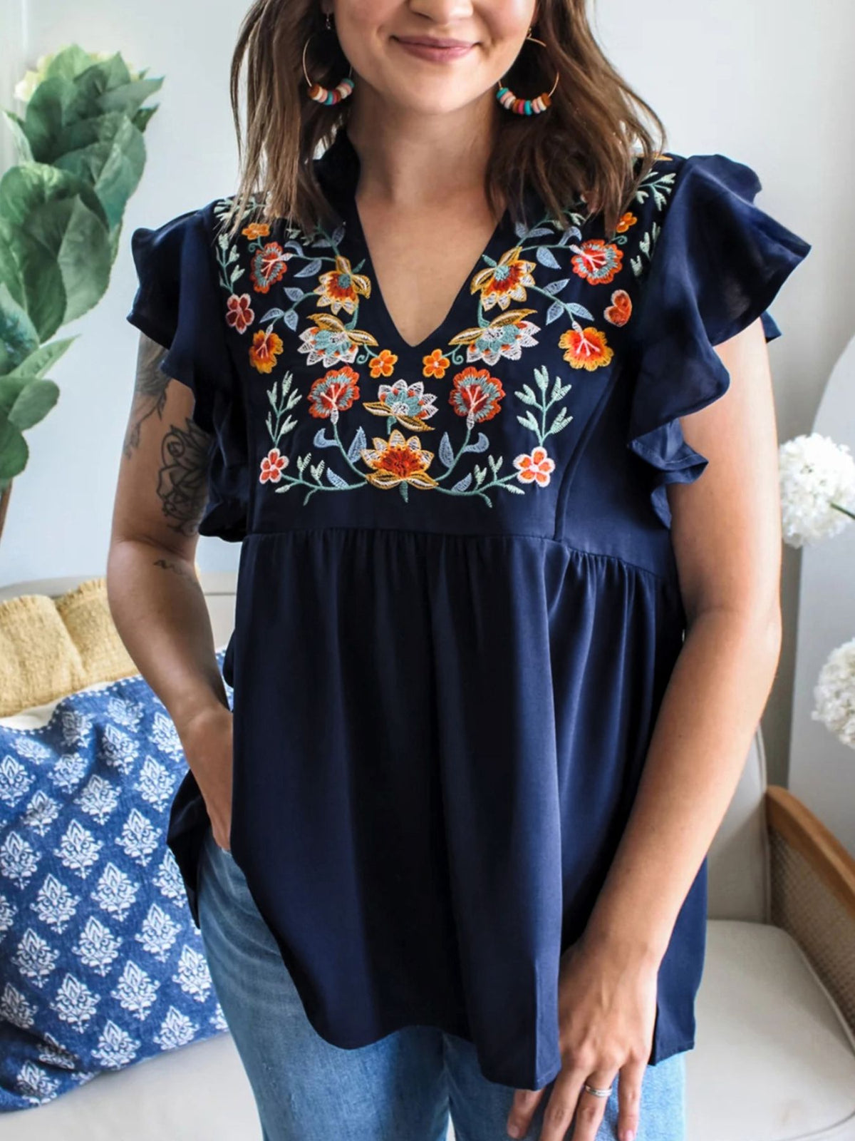 Women’s embroidered floral ruffle sleeve blouse by Plush Fashion Hub, lightweight and elegant with intricate floral embroidery.