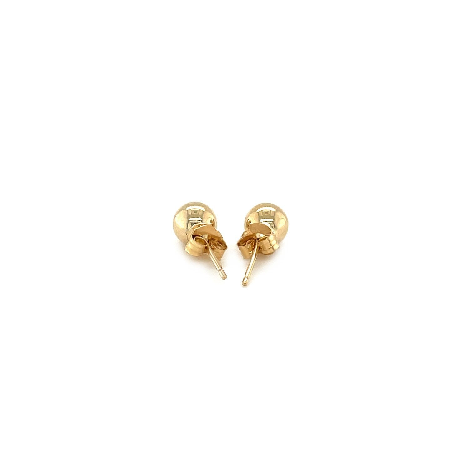 14k yellow gold round stud earrings, 5mm size, featuring classic and elegant jewelry design with secure post backing.