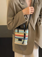 Striped woven mini crossbody bag from Trendsi with adjustable strap and colorful pattern, perfect for casual outings.