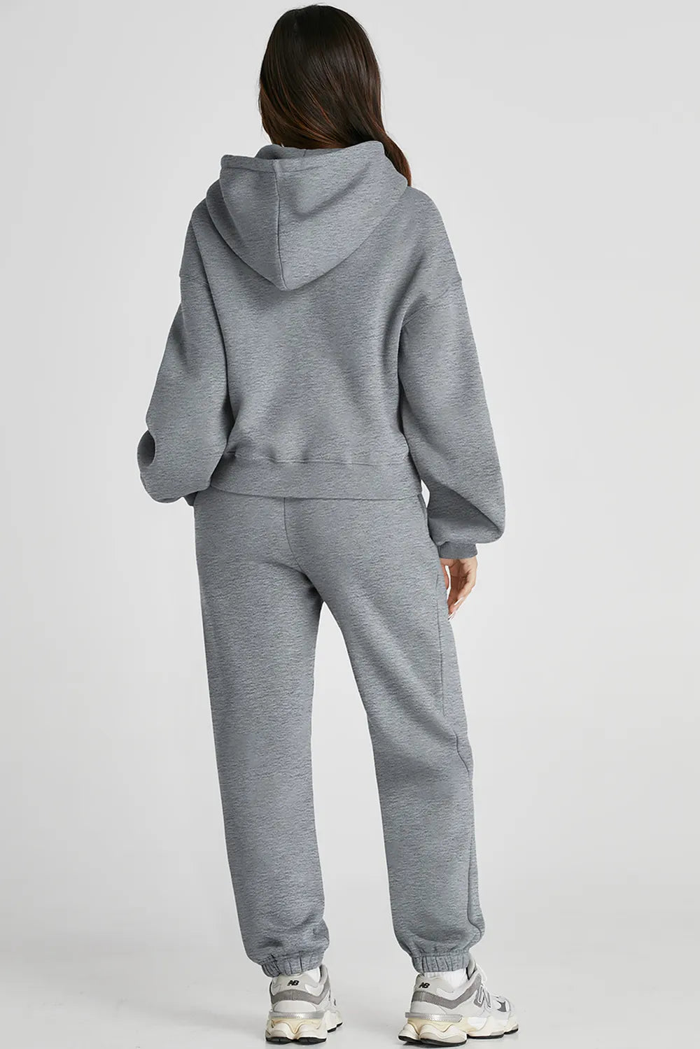 Dropped shoulder hooded top and matching pants activewear set by Plush Fashion Hub, casual athletic outfit in soft fabric.