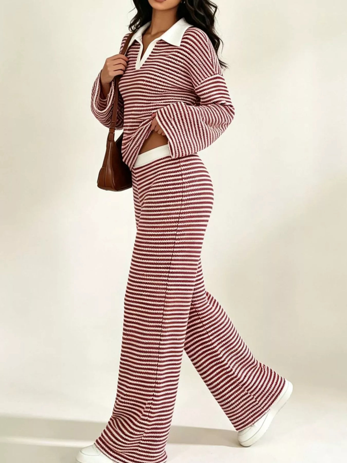 Striped long sleeve polo and wide-leg pants set from Trendsi, featuring a coordinated matching ensemble with bold stripes.