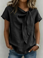 Women's loose-fit short sleeve casual pullover T-shirt by FitiqueFit, shown in a relaxed fit with a round neckline.
