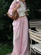 Trendsi loungewear set with button-up shirt and drawstring pants, featuring soft fabric and casual fit, displayed on a hanger.