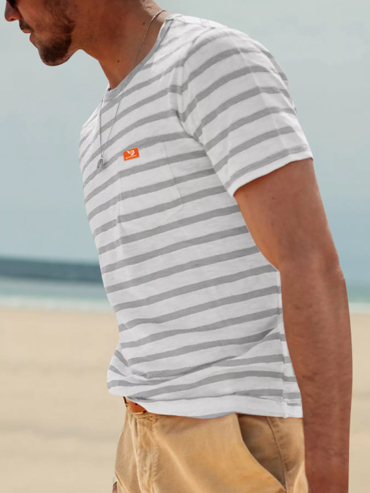 Men's plus size striped pocket short sleeve t-shirt by Plush Fashion Hub, showing blue and white horizontal stripes with chest pocket.