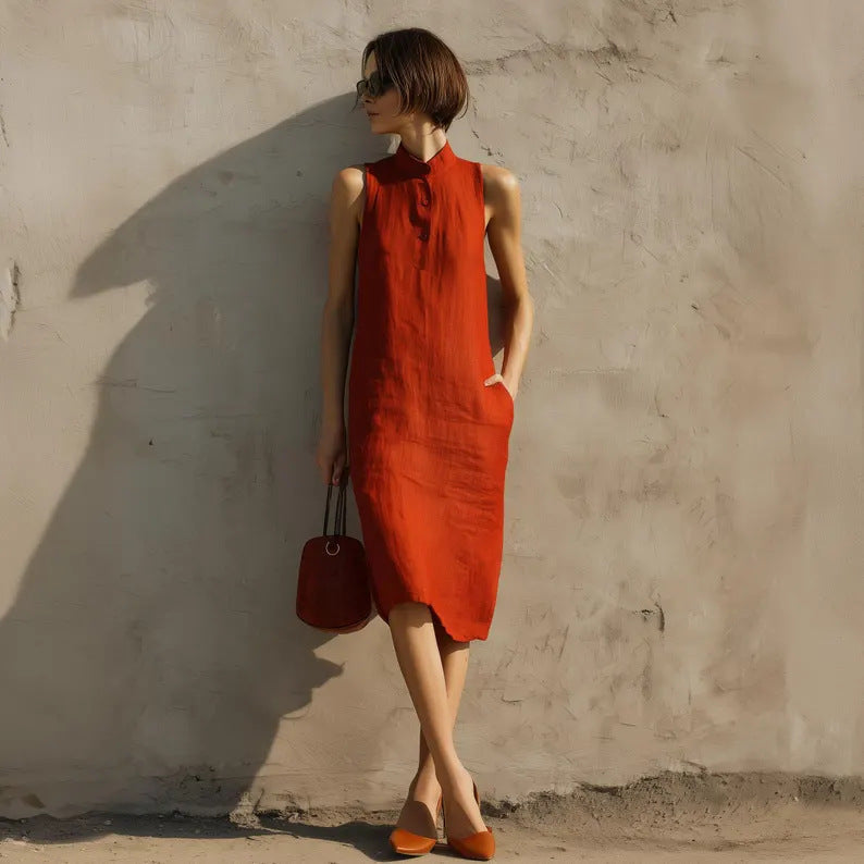Women's sleeveless A-line midi dress in solid cotton linen fabric, casual style by Plush Fashion Hub, shown in a natural pose.