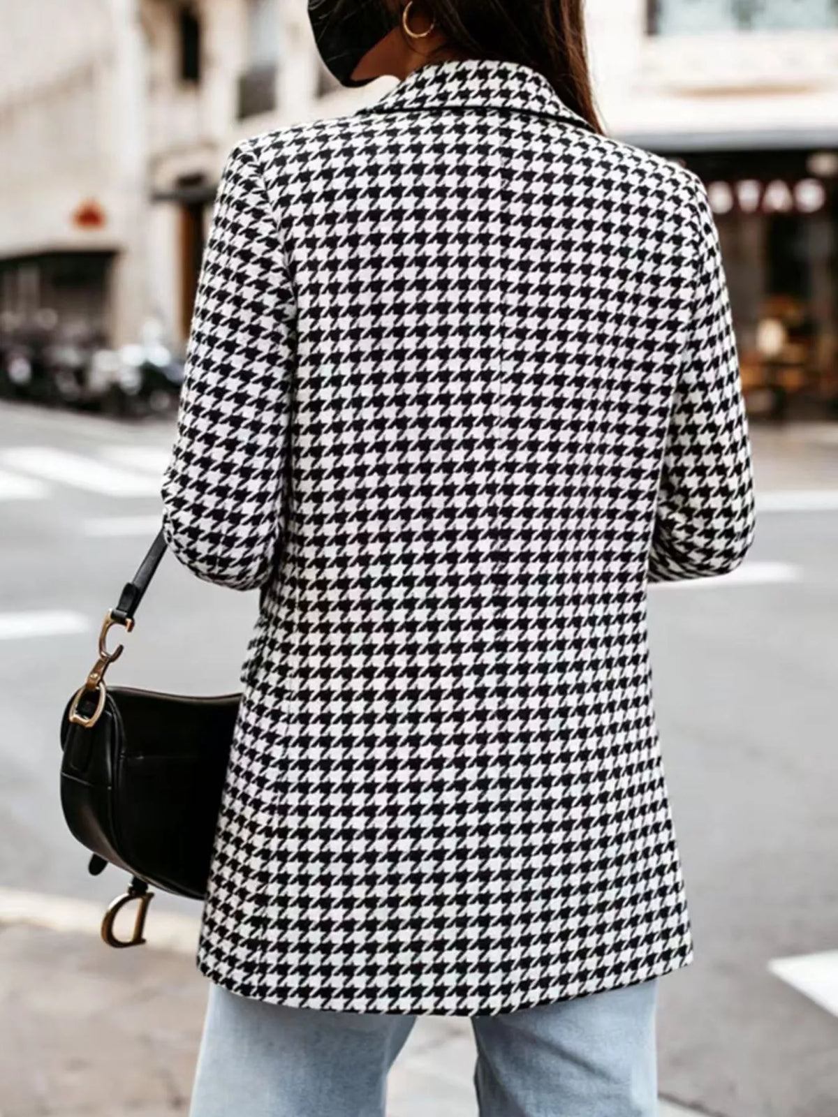 Classic houndstooth double-breasted blazer from Trendsi, featuring a tailored fit and stylish pattern, shown on a hanger.