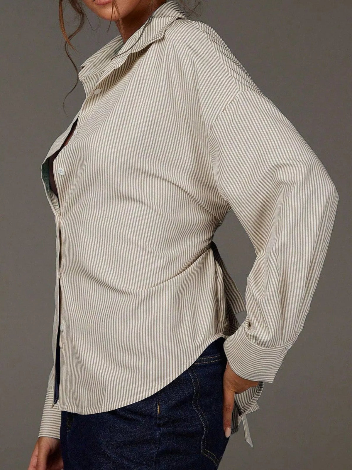 Casual striped button-down shirt from Trendsi featuring a collar, long sleeves, and a relaxed fit in blue and white.