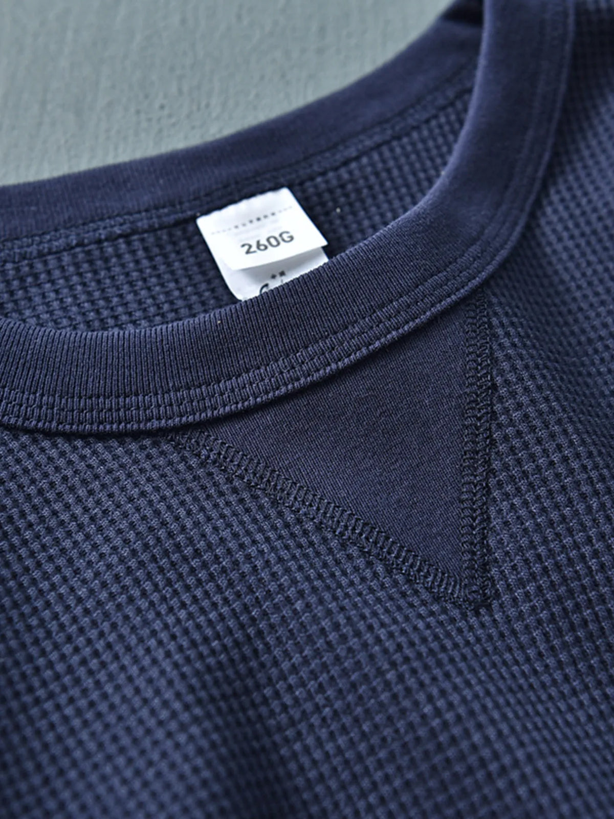 Plus size men's round neck long sleeve T-shirt by Trendsi, navy blue, soft fabric, casual fit, shown on a model.
