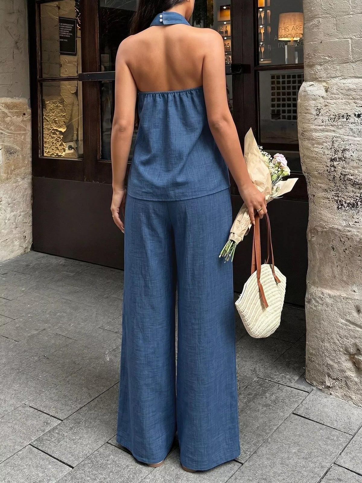 Plush Fashion Hub halter neck top and wide-leg pants set, stylish two-piece outfit with a trendy fit and comfortable fabric.