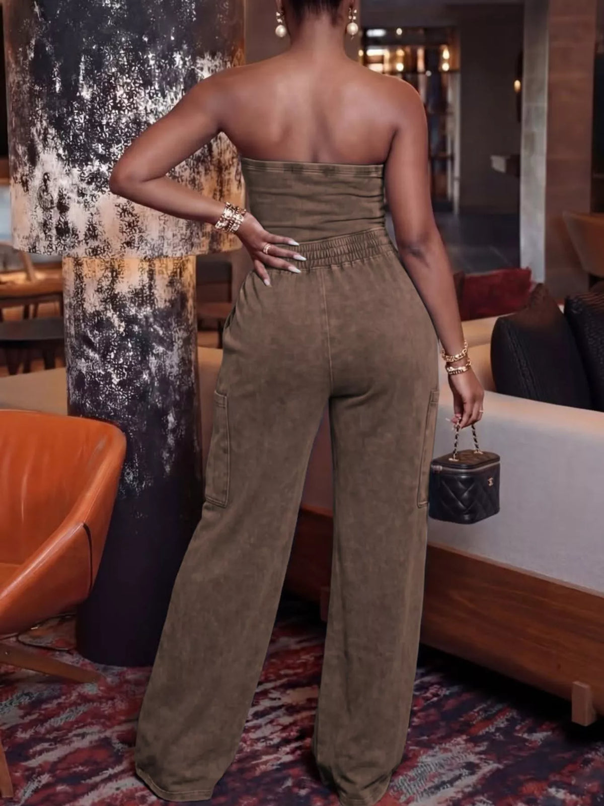 Plush Fashion Hub strapless wide-leg jumpsuit with drawstring waist, sleeveless playsuit in lightweight fabric on model.