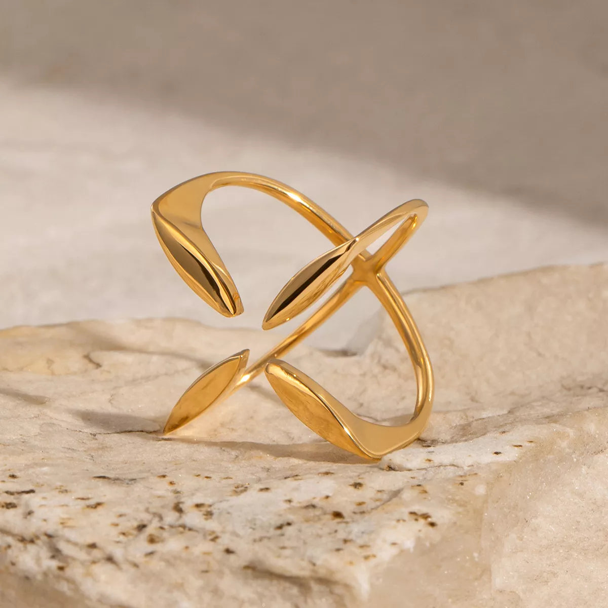 Stainless steel crisscross open ring with sleek silver finish, stylish jewelry piece from Plush Fashion Hub.